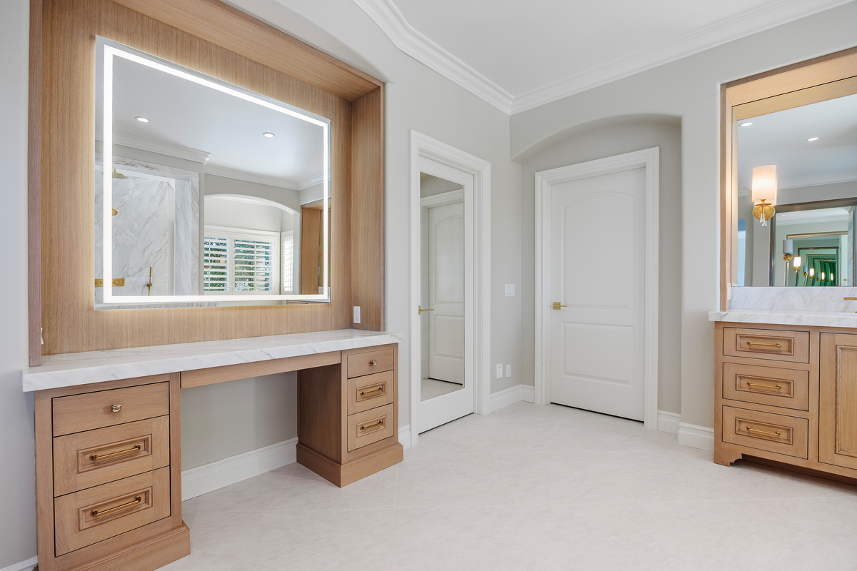 La-Costa-Whole-Home-Remodel-30-11958507-130 Custom bathroom makeup vanity in a La Costa home remodel in Carlsbad featuring built-in cabinets, modern design, and organized storage.