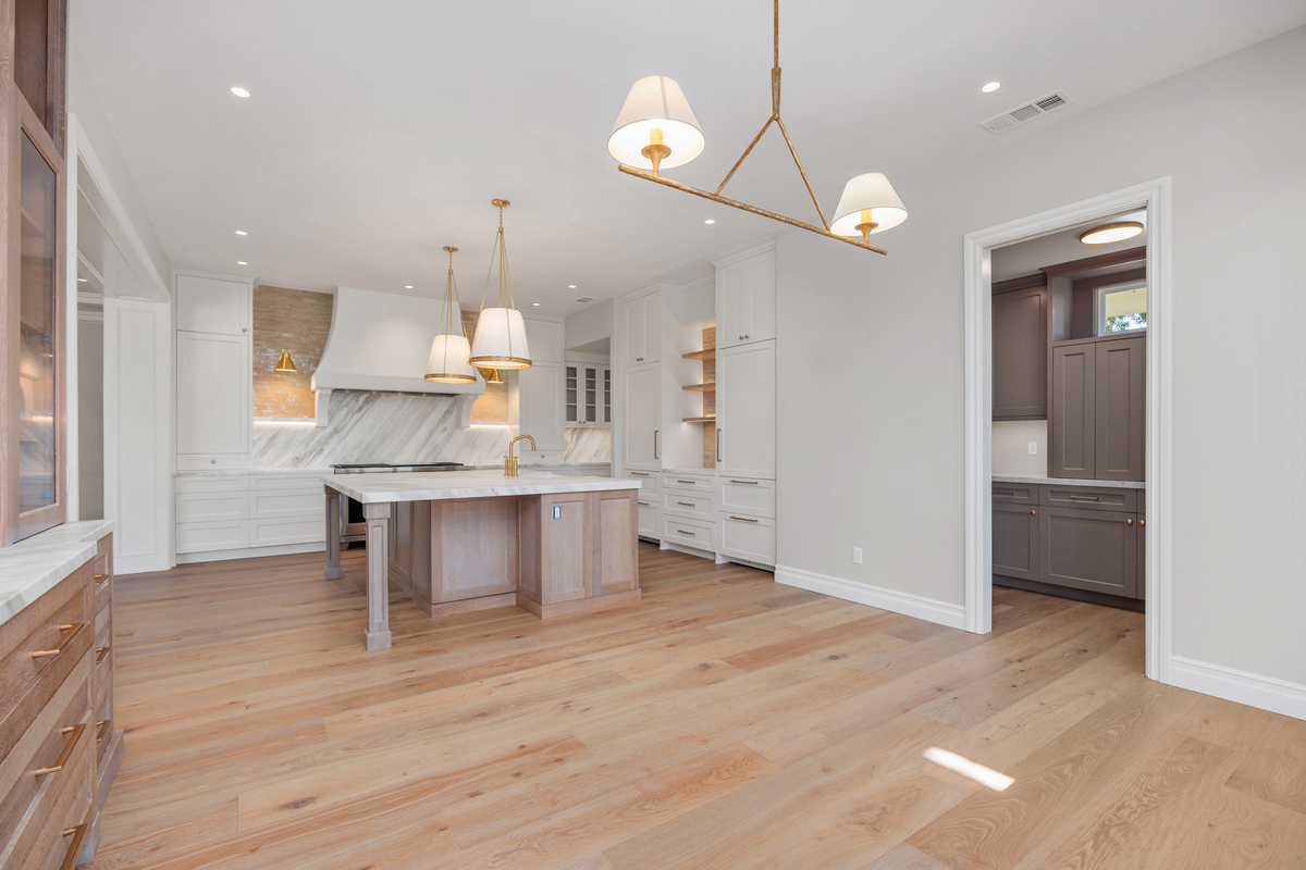 Custom kitchen island in a La Costa home remodel in Carlsbad featuring modern design, seating area, and open-concept layout.