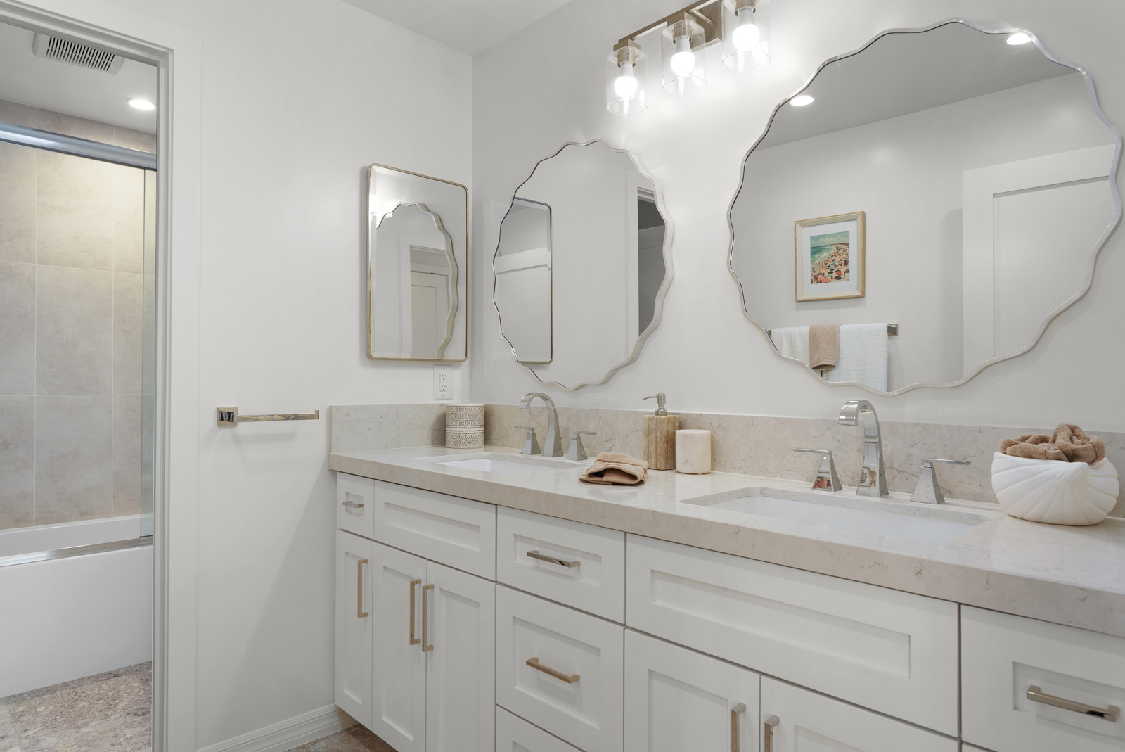 Contemporary bathroom with custom vanity, designer mirrors, and premium finishes in San Diego.
