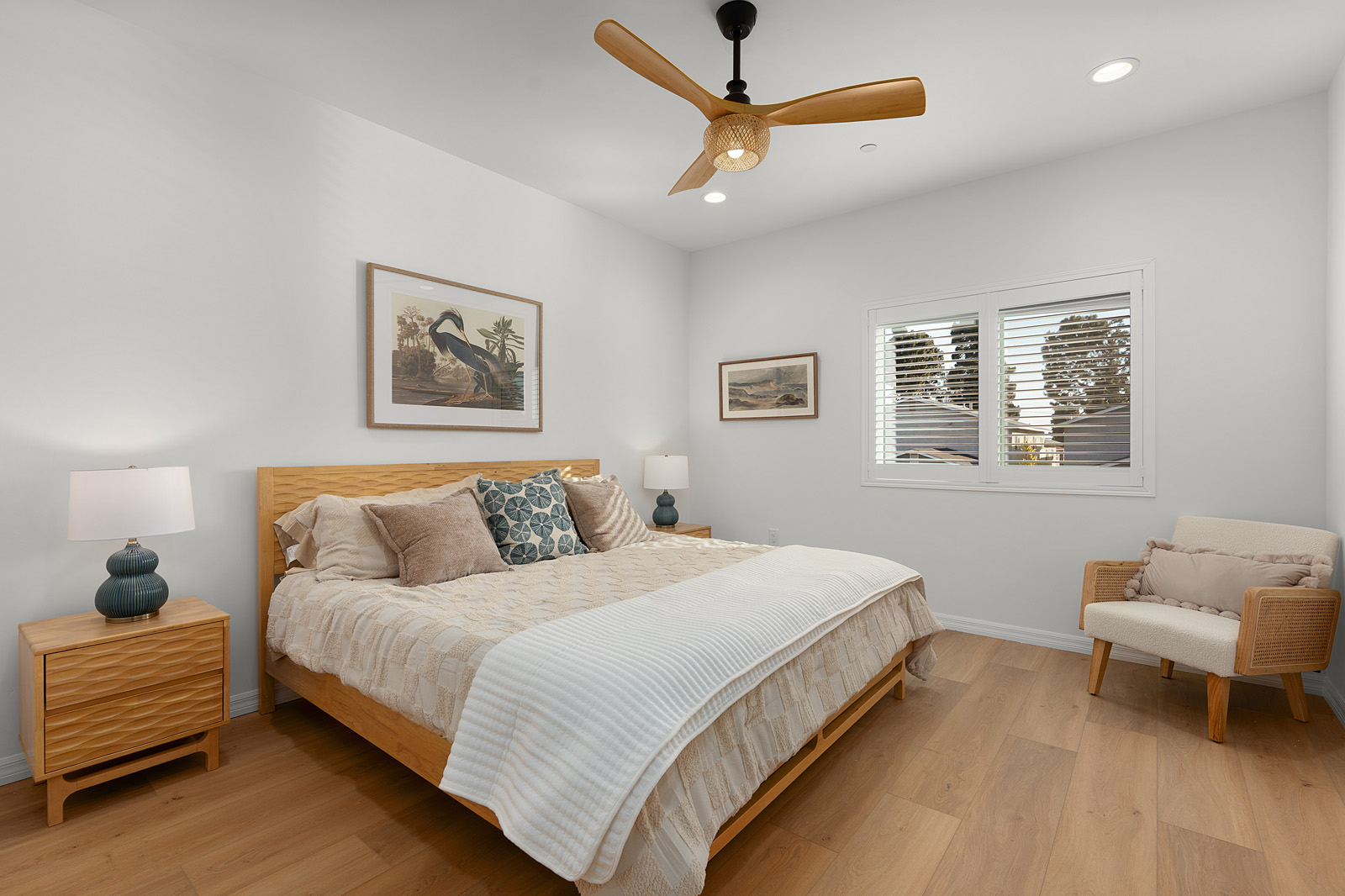 Secondary bedroom with custom furnishings inside a San Diego new construction residence.